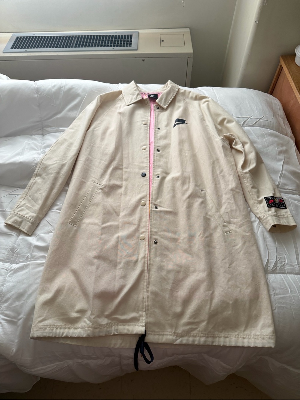 Nike unisex Cream Coach Jacket with Pink Trim
